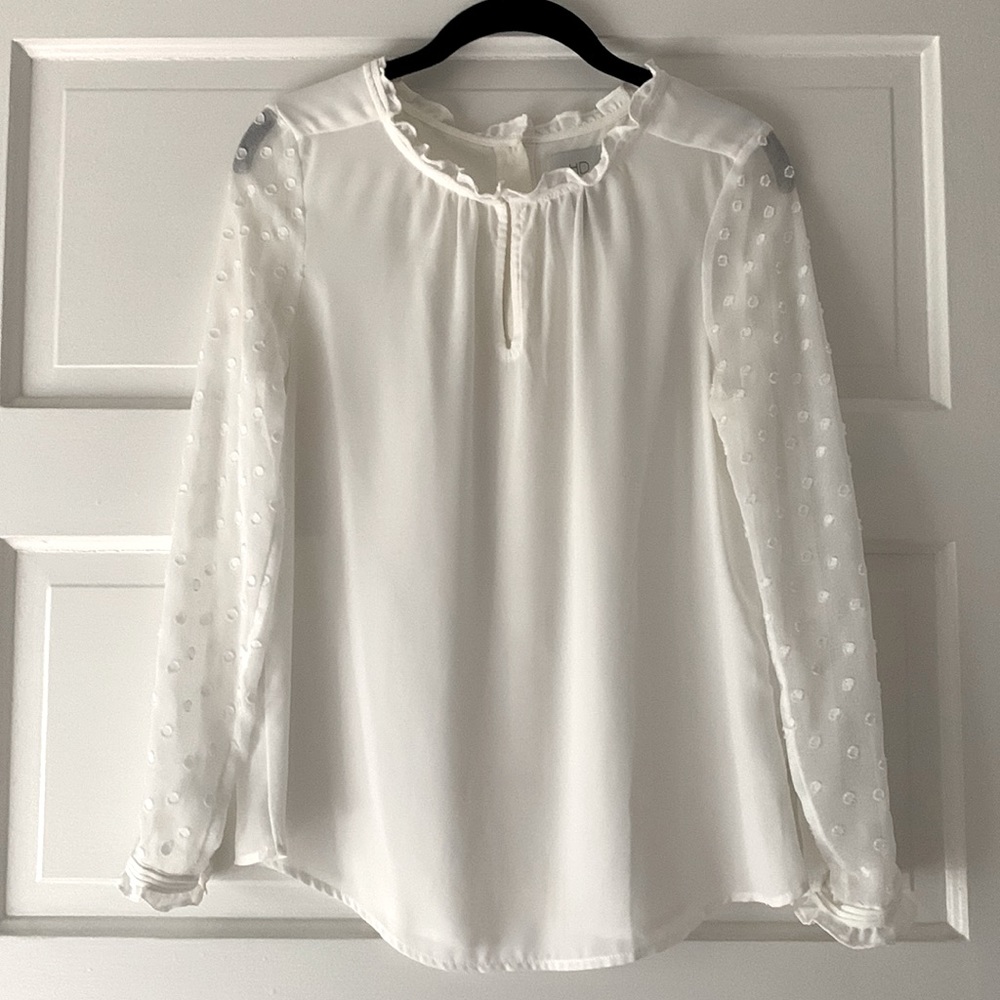 HD in Paris white dress blouse. Long sheer sleeves with polka dots.